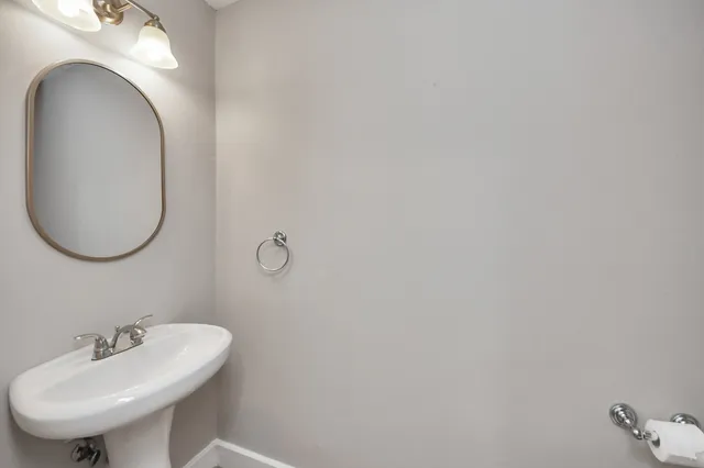 a view of walk in closet with wooden floor