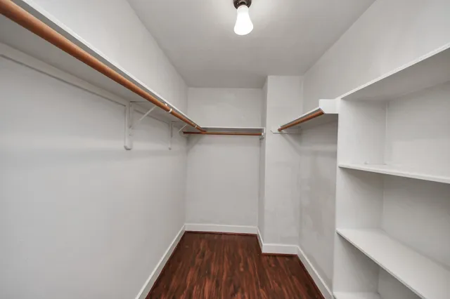 an aerial view of residential building and lake