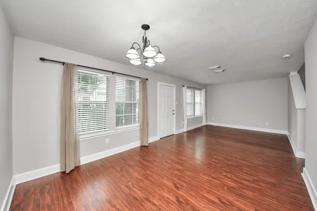 a view of a livingroom with a ceiling fan and window