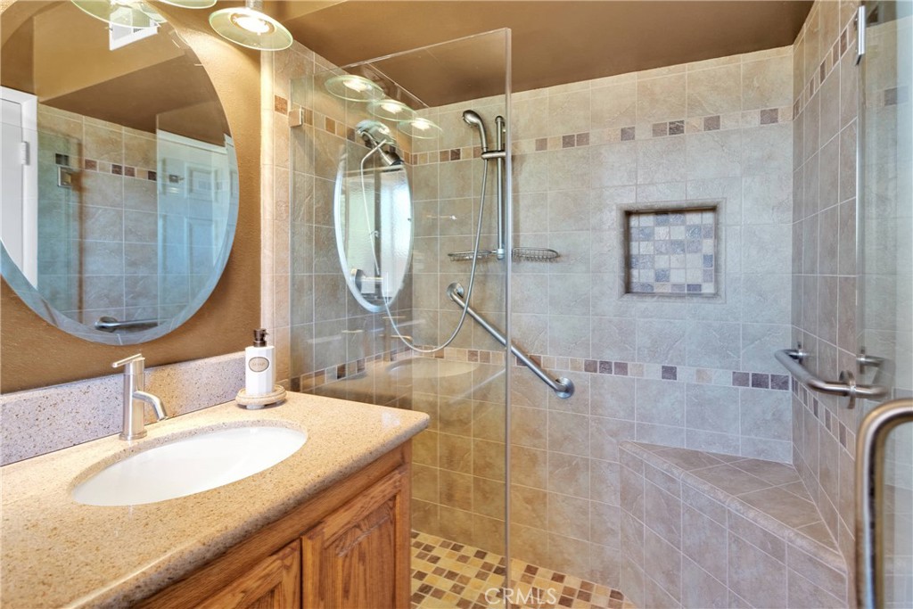 19955 Chickasaw Road Apple Valley, CA 92307 - Photo 31 of 60 a bathroom with a sink double vanity and a mirror