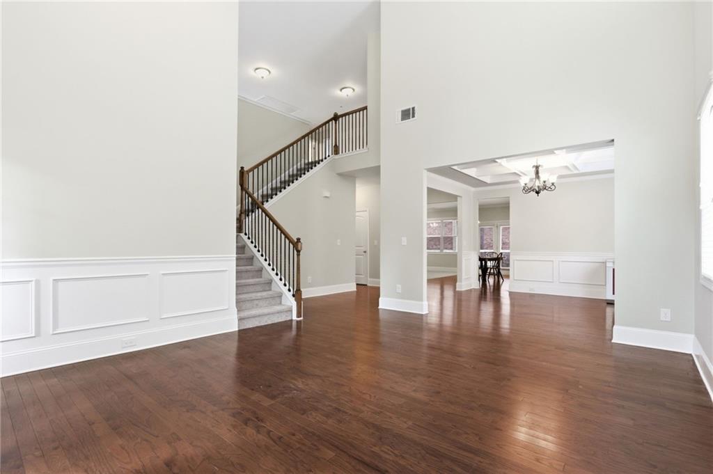 1515 Riva Ridge Suwanee, GA 30024 - Photo 4 of 35 a view of empty room with wooden floor and stairs