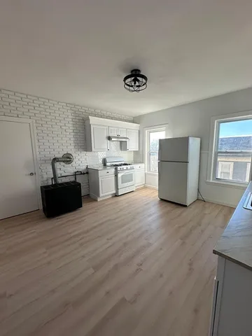 a view of a kitchen with storage and utility