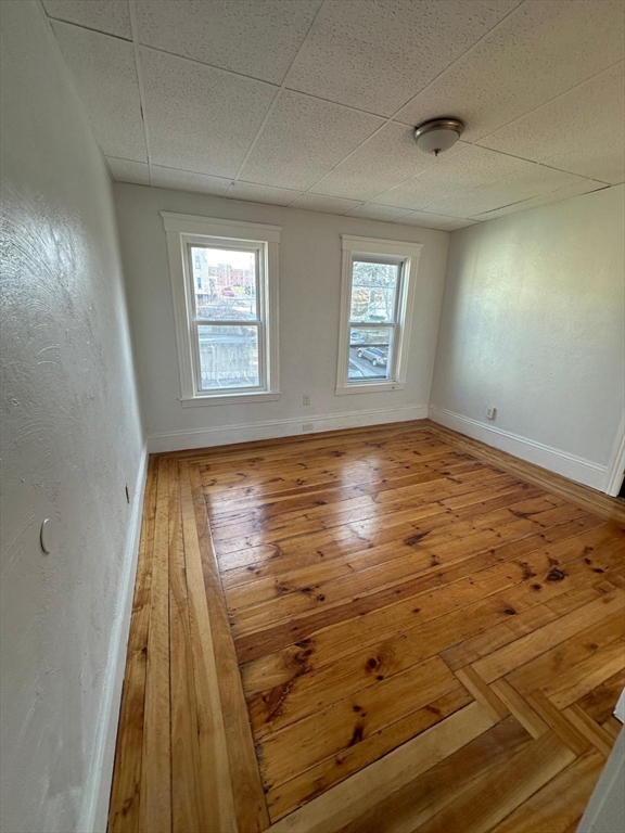 11 Alpine Street, Unit 3 Worcester, MA 01610 - Photo 9 of 14 a view of wooden floor and windows in a room