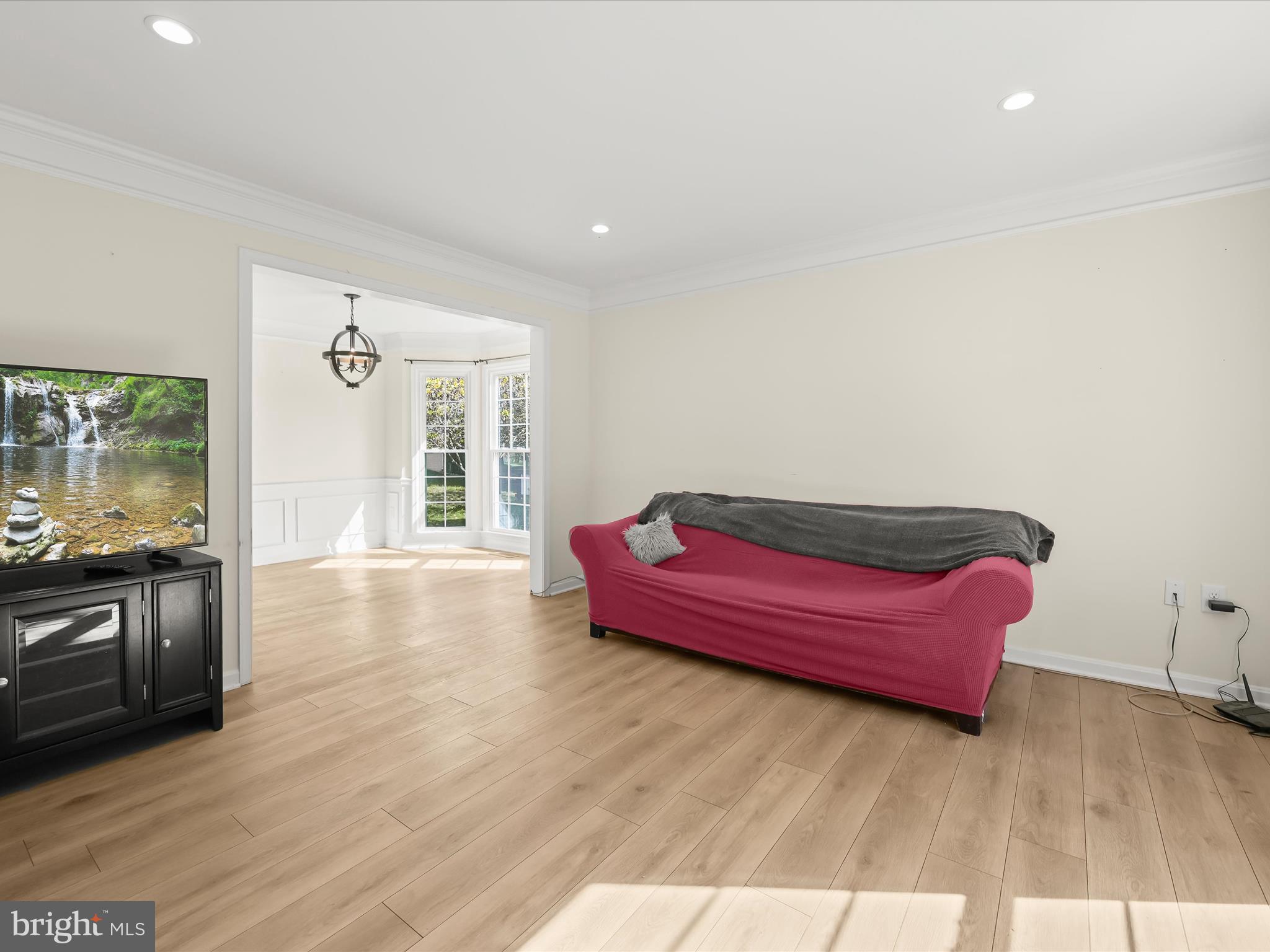 8806 Admiral Drive Laurel, MD 20708 - Photo 12 of 59 a living room with furniture and wooden floor