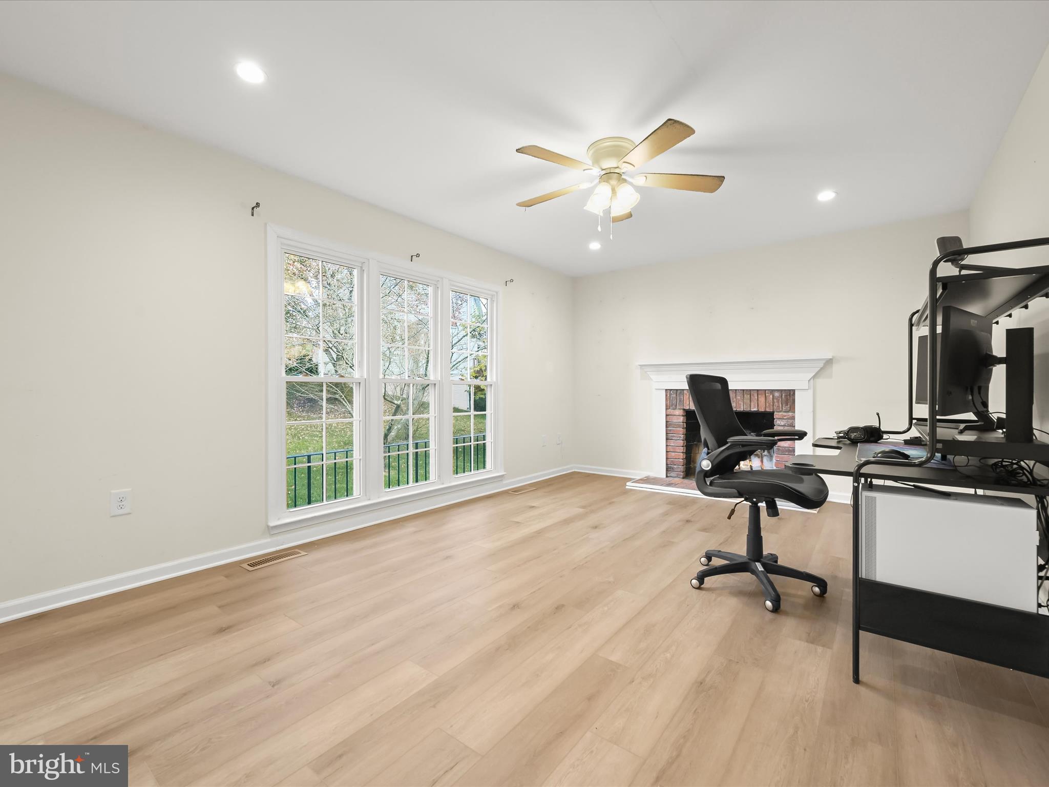 8806 Admiral Drive Laurel, MD 20708 - Photo 19 of 59 a view of a workspace with furniture and a window