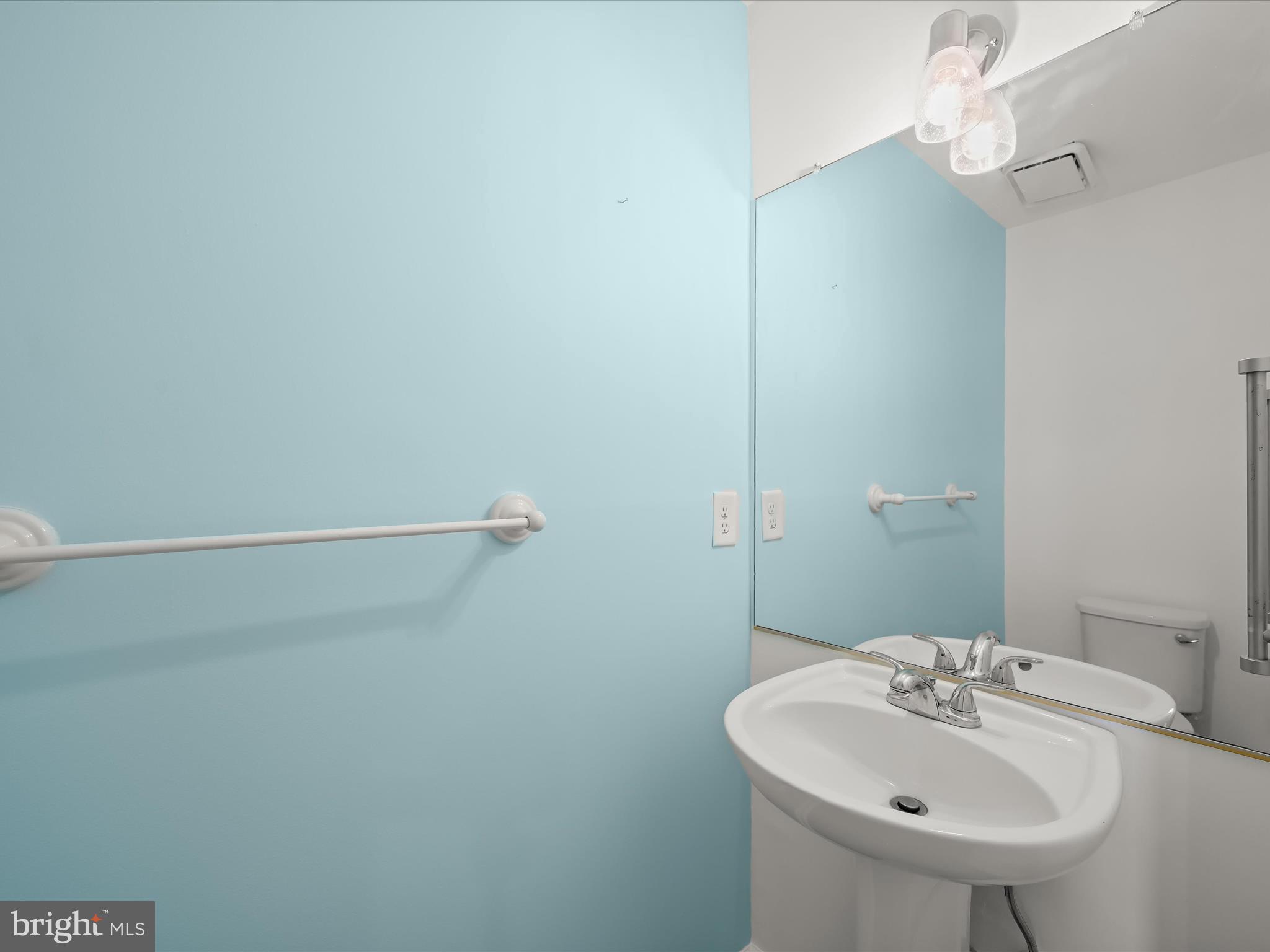 8806 Admiral Drive Laurel, MD 20708 - Photo 22 of 59 a bathroom with a sink and mirror