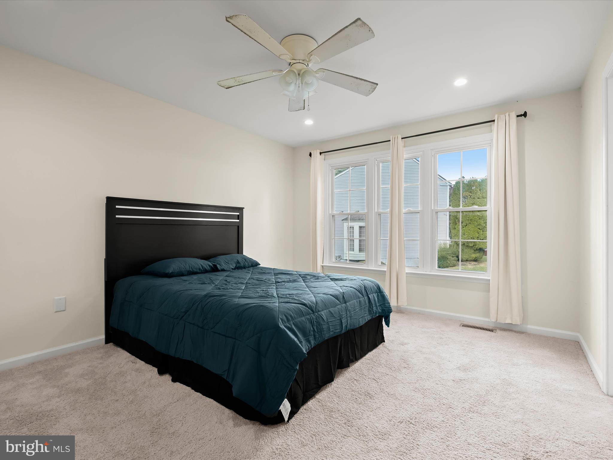 8806 Admiral Drive Laurel, MD 20708 - Photo 23 of 59 a bedroom with a bed and window