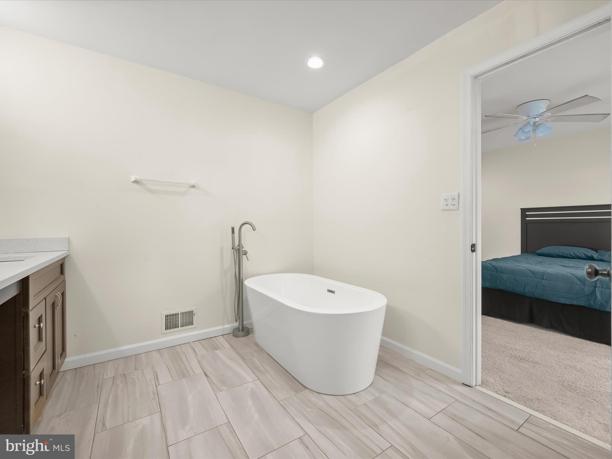 8806 Admiral Drive Laurel, MD 20708 - Photo 28 of 59 a view of a room with wooden floor and sink