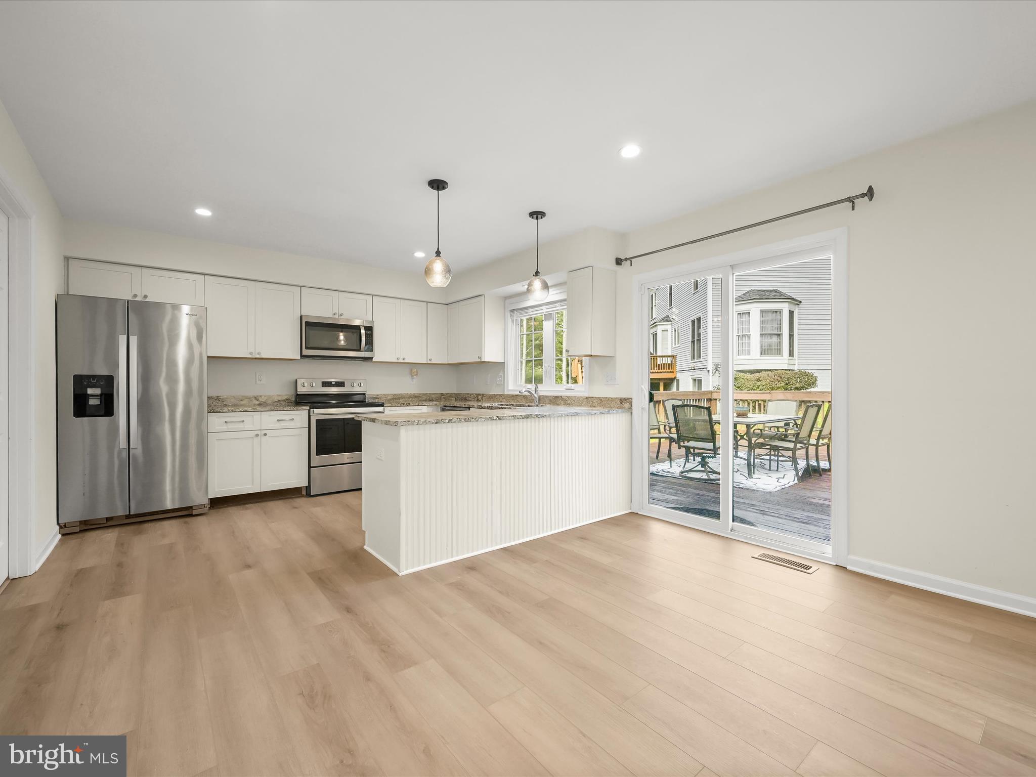 8806 Admiral Drive Laurel, MD 20708 - Photo 3 of 59 a kitchen with stainless steel appliances a refrigerator and a stove top oven