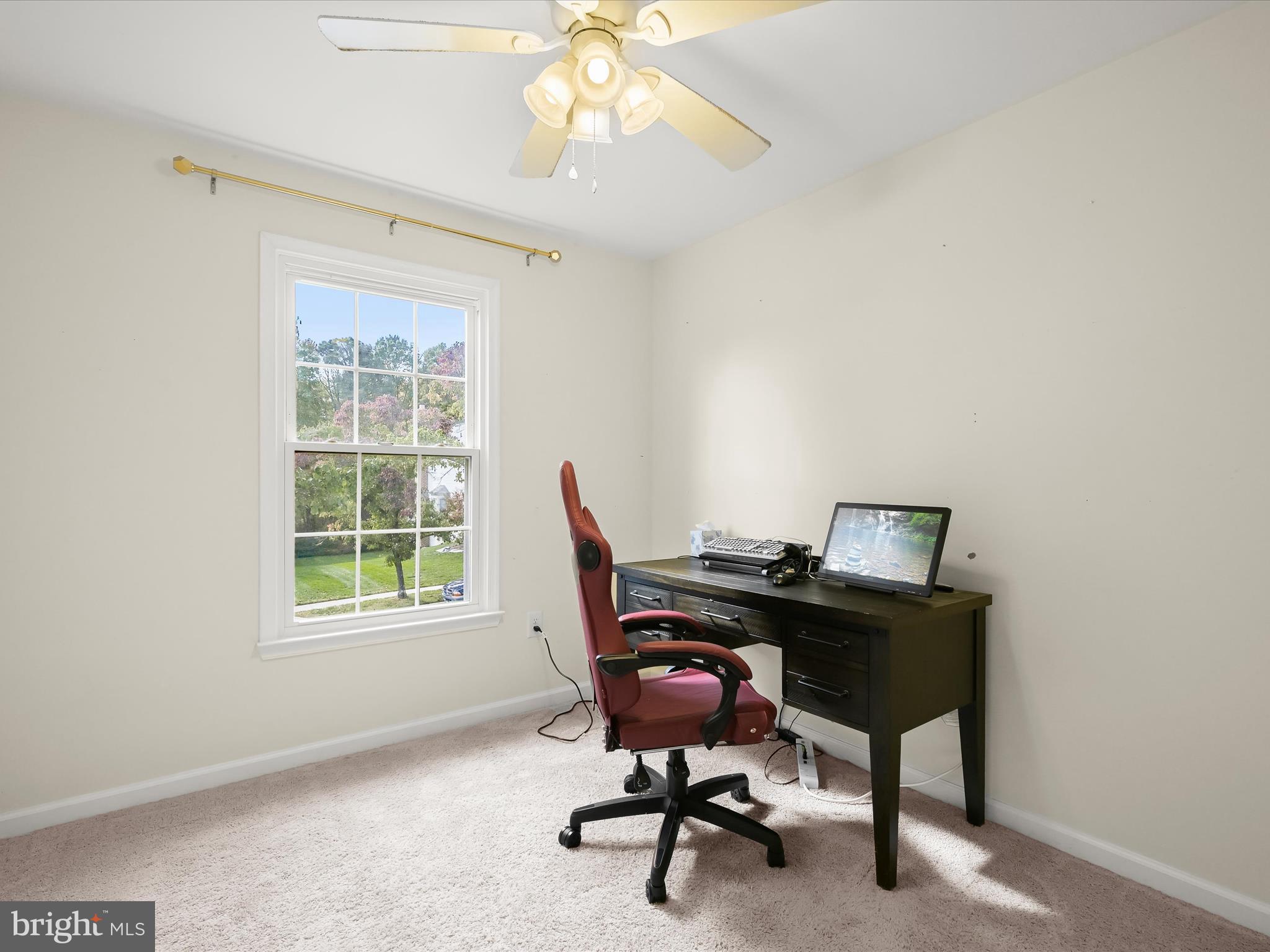 8806 Admiral Drive Laurel, MD 20708 - Photo 31 of 59 a view of a workspace with furniture and a window