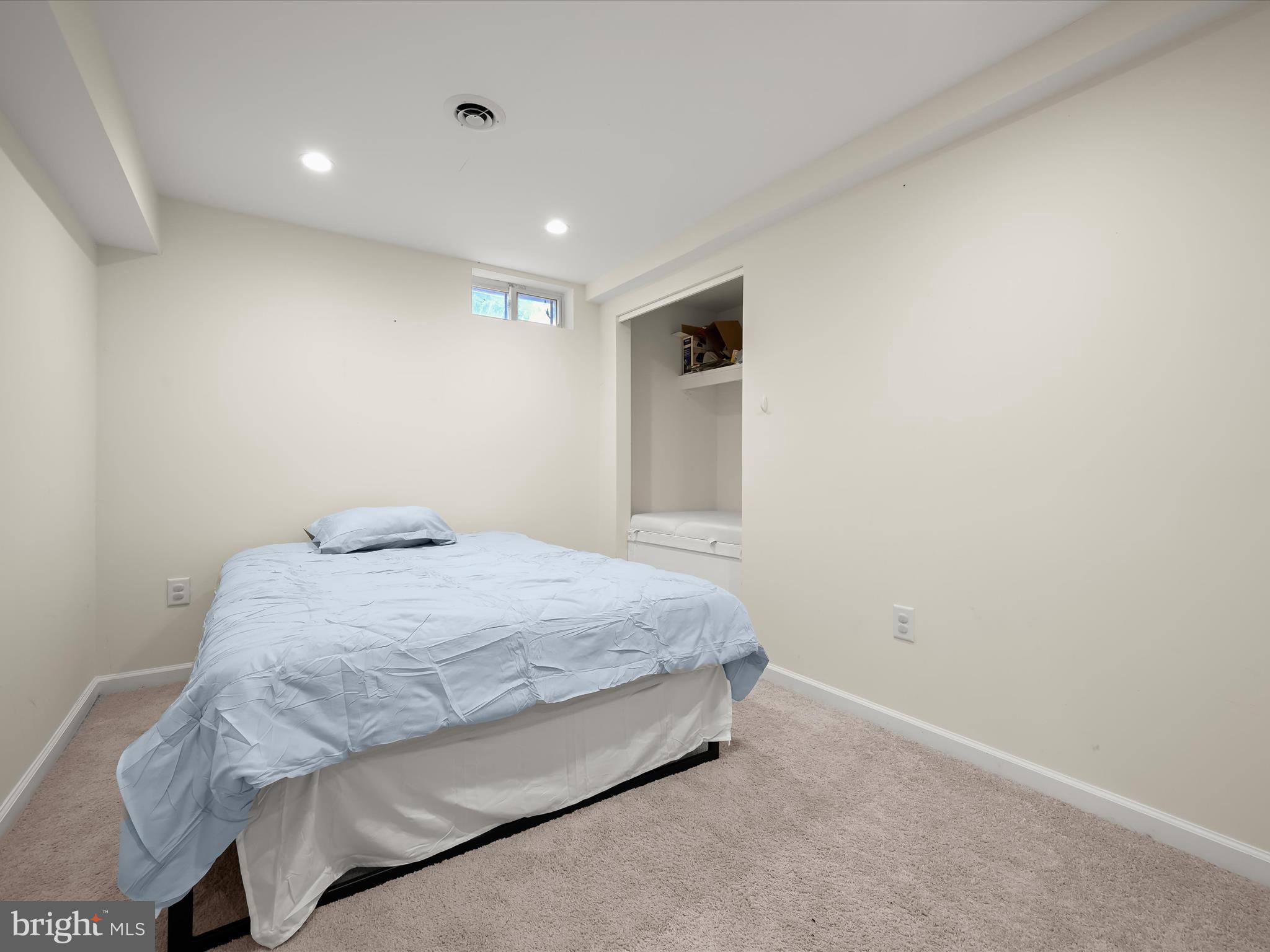 8806 Admiral Drive Laurel, MD 20708 - Photo 40 of 59 a bedroom with a bed and a window