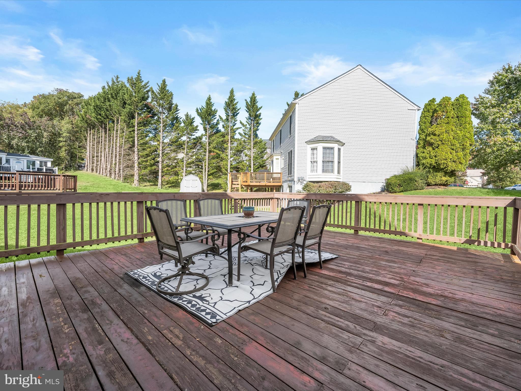 8806 Admiral Drive Laurel, MD 20708 - Photo 45 of 59 a view of a chairs and table on the wooden deck