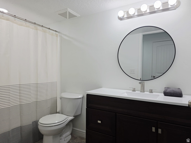 1437 925 South Vernal, UT 84078 - Photo 28 of 47 Modern bathroom featuring a dark wood-finish vanity with a white countertop and undermount sink