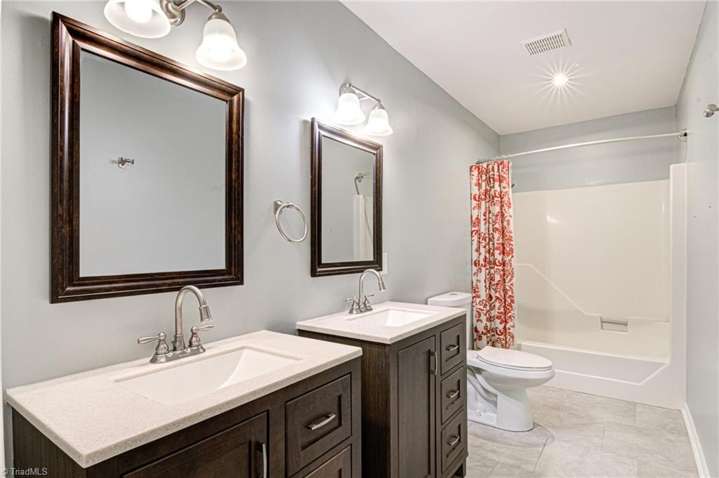 5101 Tower Road Greensboro, NC 27410 - Photo 12 of 36 Guest bathroom main level