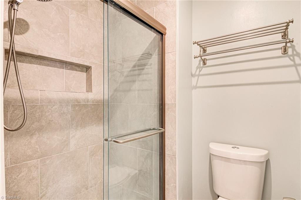 5101 Tower Road Greensboro, NC 27410 - Photo 17 of 36 main level master bathroom