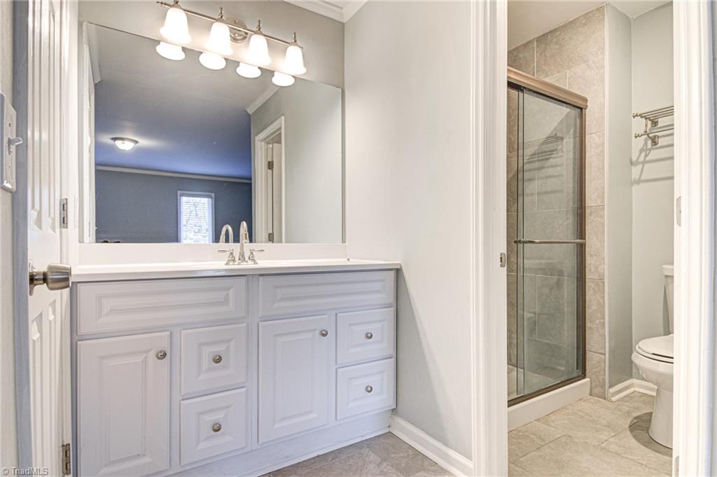 5101 Tower Road Greensboro, NC 27410 - Photo 18 of 36 main level master bathroom