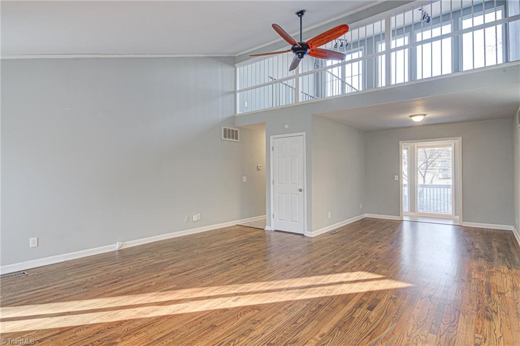 5101 Tower Road Greensboro, NC 27410 - Photo 23 of 36 Den- the door leads to loft