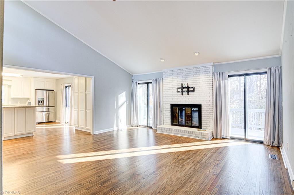 5101 Tower Road Greensboro, NC 27410 - Photo 25 of 36 cathedral ceilings and white washed fireplace