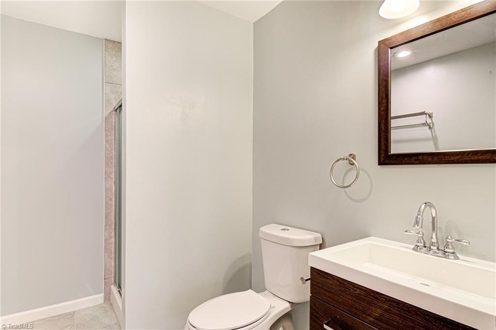 5101 Tower Road Greensboro, NC 27410 - Photo 9 of 36 basement master bathroom