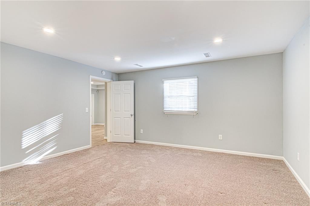 5101 Tower Road Greensboro, NC 27410 - Photo 10 of 36 basement master bedroom