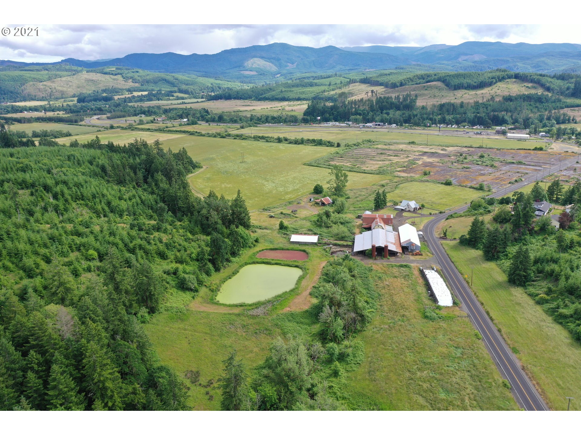 9040 Fort Hill Road Willamina, OR 97396 - Photo 1 of 27 a view of lake with mountain