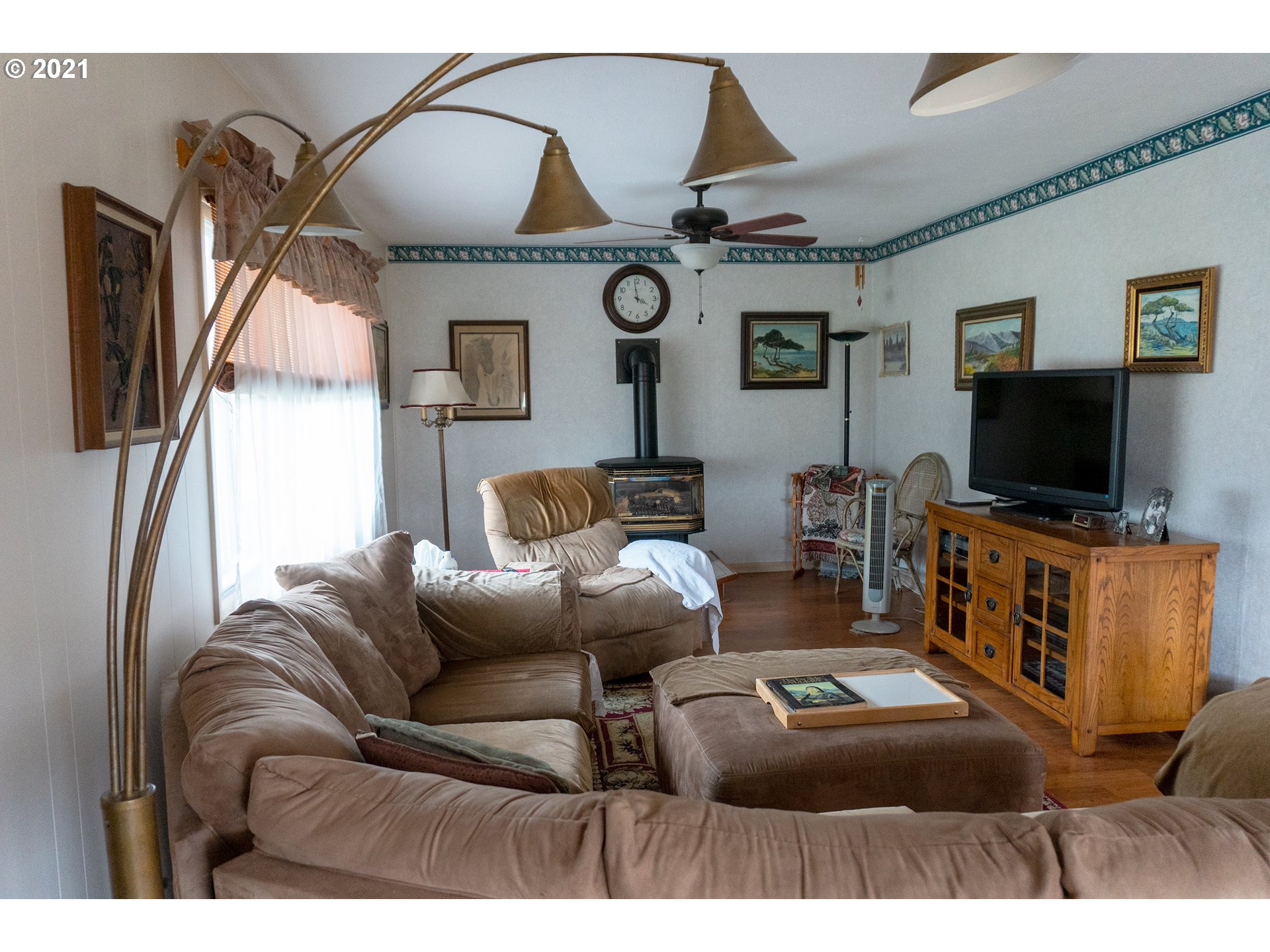 9040 Fort Hill Road Willamina, OR 97396 - Photo 14 of 27 a living room with furniture and a flat screen tv