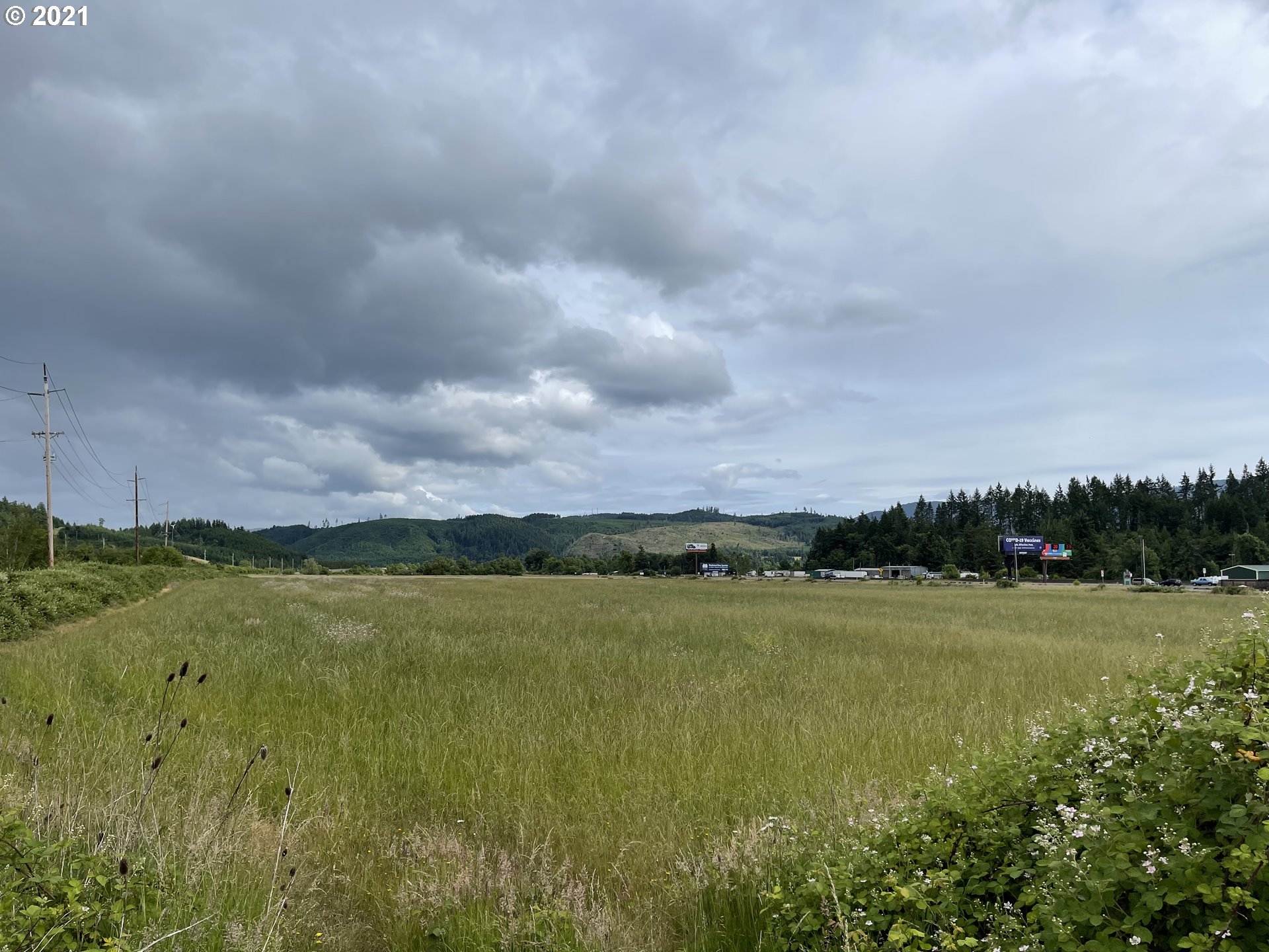 9040 Fort Hill Road Willamina, OR 97396 - Photo 23 of 27 a view of a lake with houses in the back