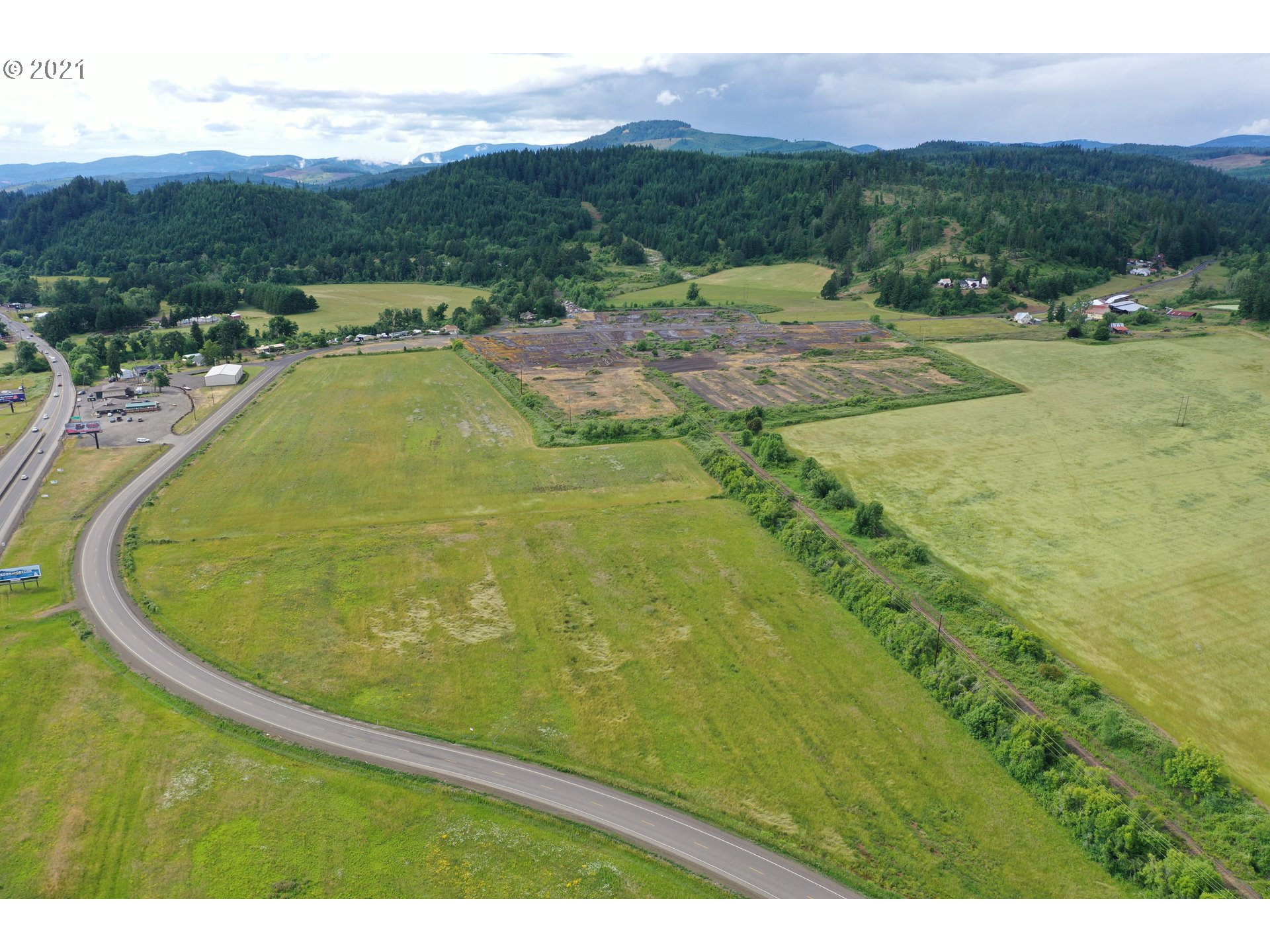 9040 Fort Hill Road Willamina, OR 97396 - Photo 9 of 27 a view of a swimming pool with a mountain