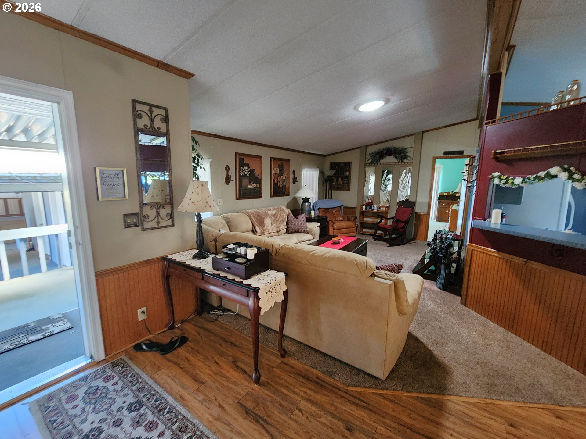 5422 Portland Road Northeast Salem, OR 97305 - Photo 2 of 14 a living room with furniture and a flat screen tv