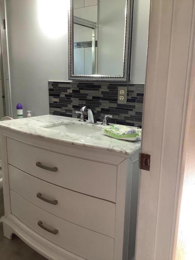 2629 El Segundo Drive Rancho Cordova, CA 95670 - Photo 31 of 63 a bathroom with a granite countertop sink and a mirror