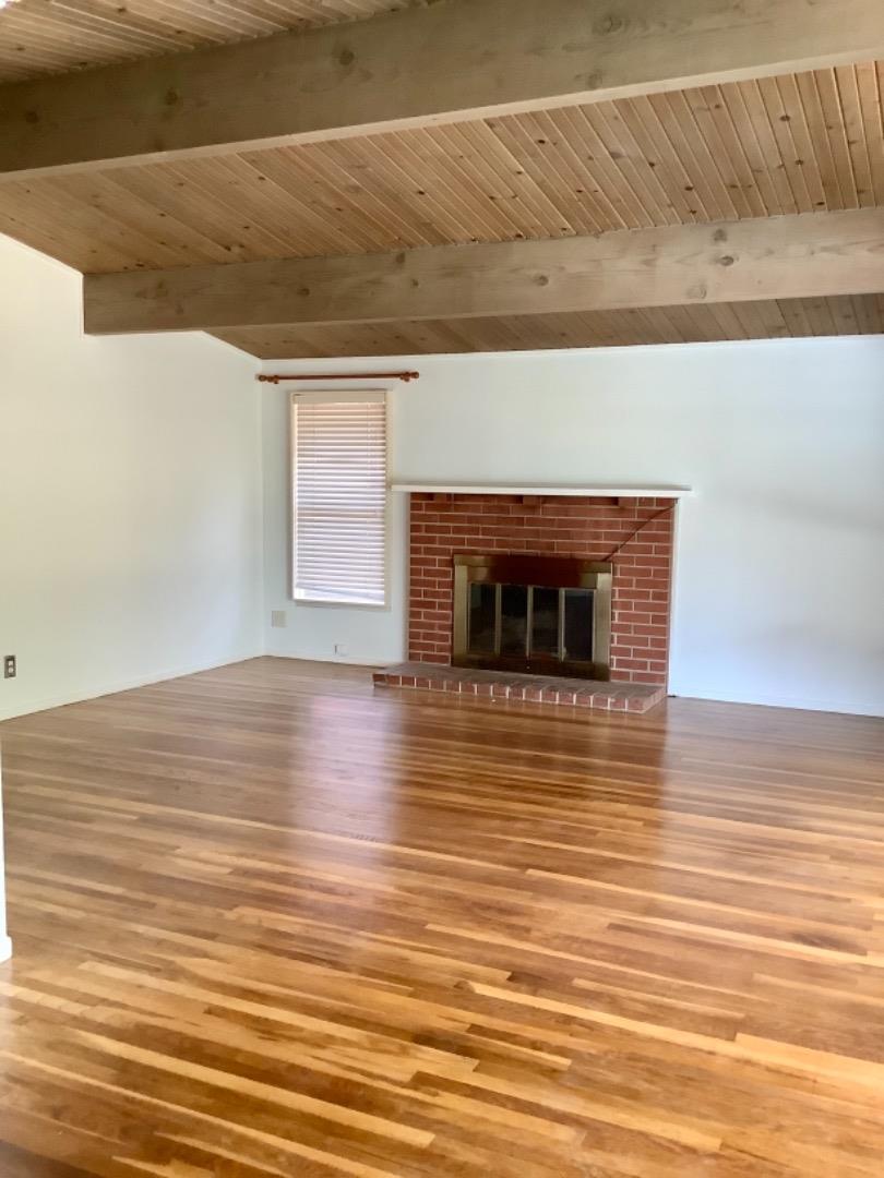 2629 El Segundo Drive Rancho Cordova, CA 95670 - Photo 9 of 63 a view of empty room with wooden floor and fireplace