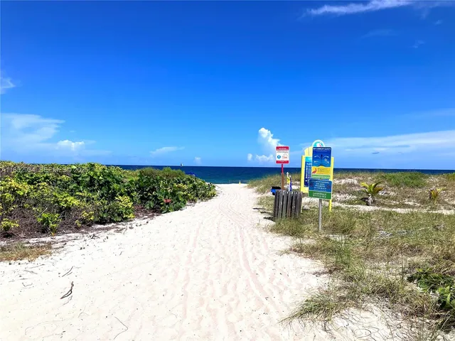 a view of swimming pool from a balcony