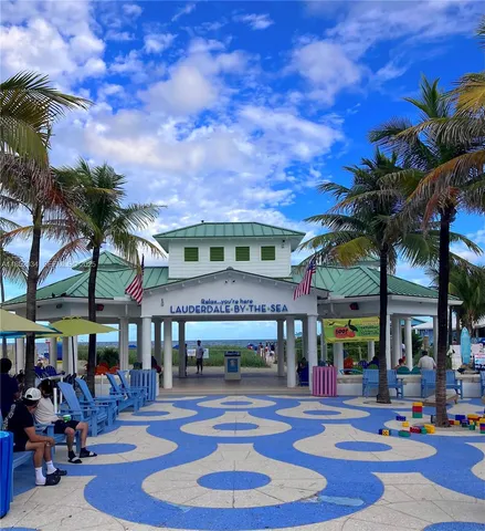 a view of swimming pool with sitting area
