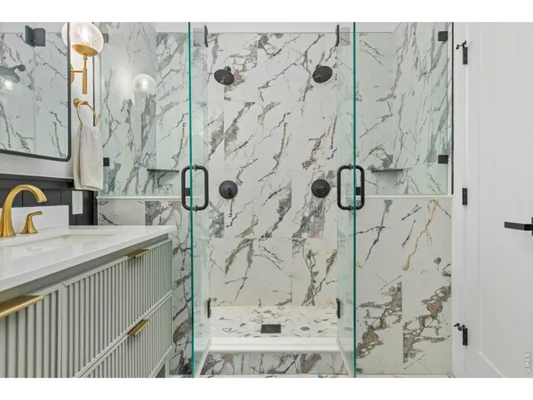 a bathroom with a sink and mirror