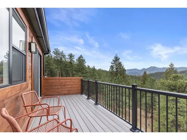 a view of balcony with furniture