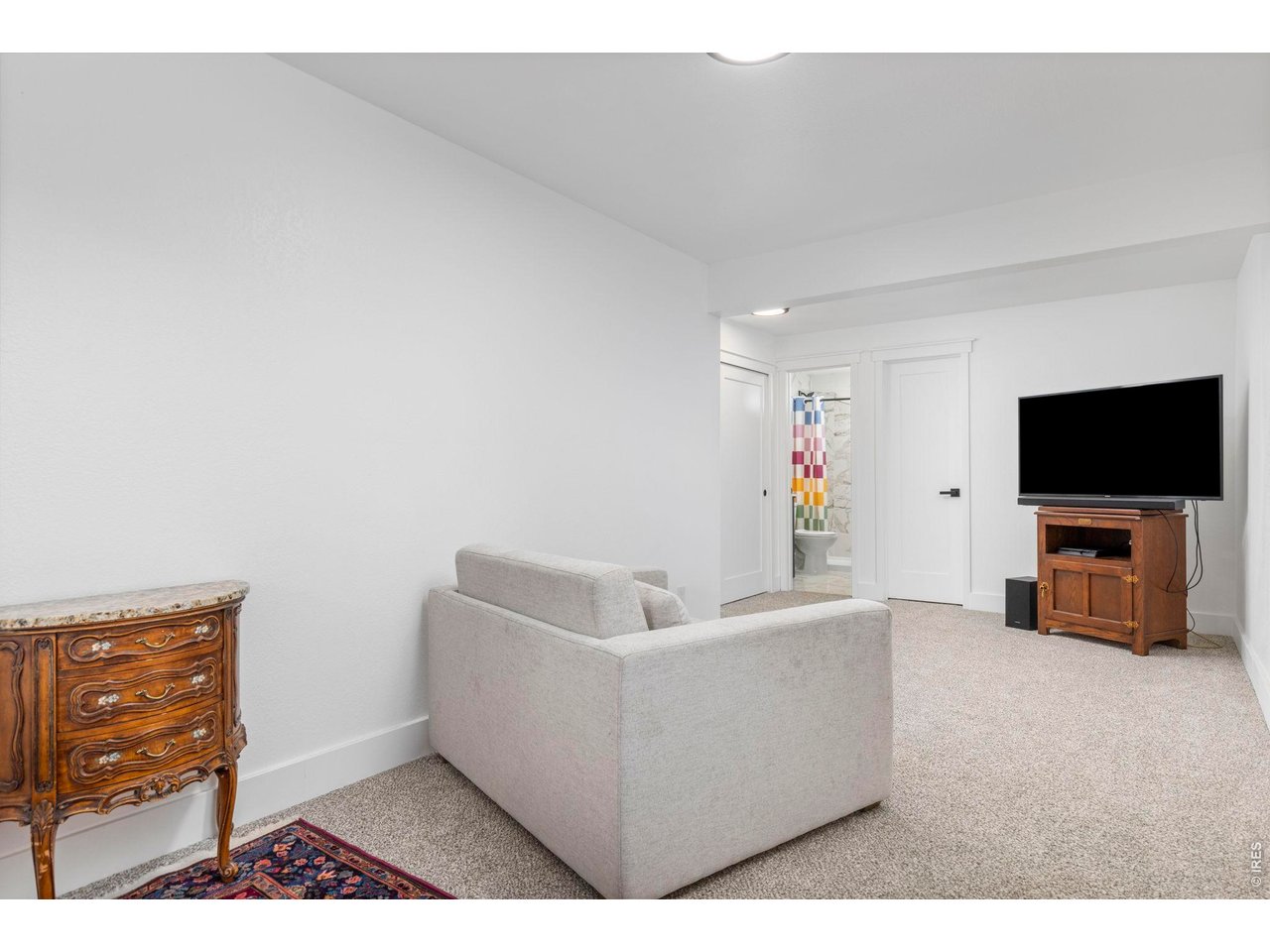 1406 Pika Road Boulder, CO 80302 - Photo 29 of 50 Lower level rec room with full bath and separate entrance. Could also be an office or a guest suite.