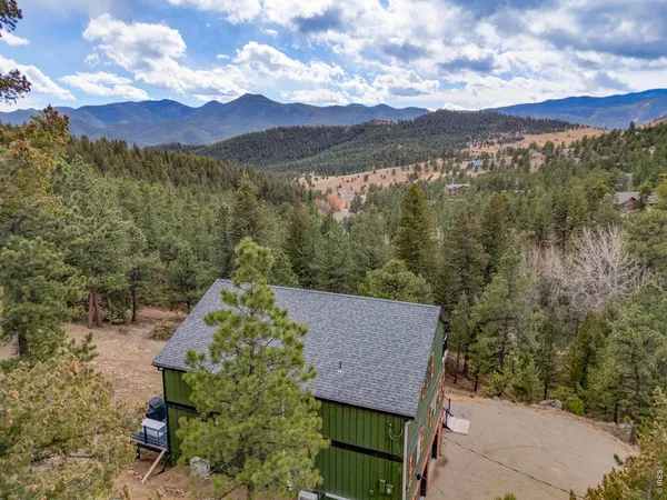 a view of a lot of a mountain from a yard