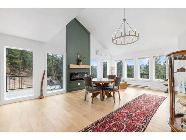 a view of a dining room with furniture window and wooden floor