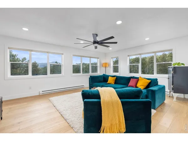a living room with blue floor and pool table