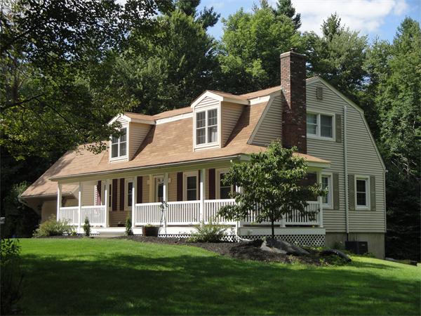 82 Campground Road Sterling, MA 01564 - Photo 1 of 23 a front view of a house with a garden