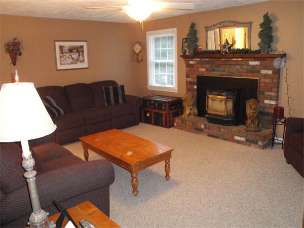 82 Campground Road Sterling, MA 01564 - Photo 12 of 23 a living room with furniture and a fireplace