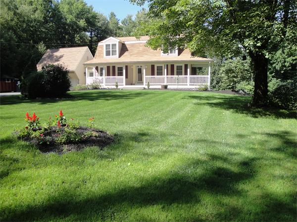 82 Campground Road Sterling, MA 01564 - Photo 15 of 23 a front view of a house with a garden and trees