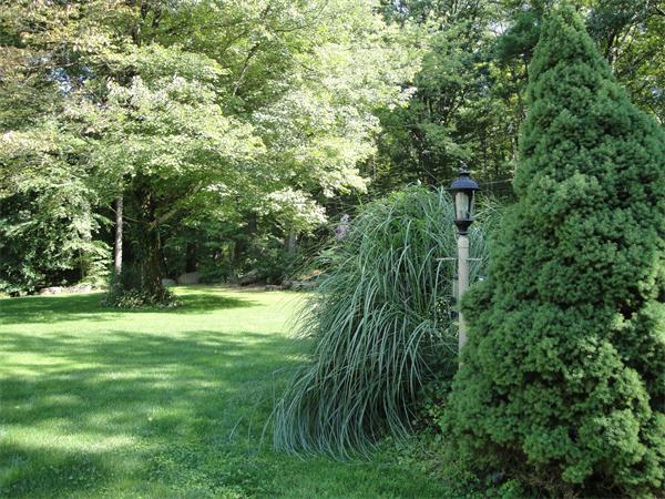 82 Campground Road Sterling, MA 01564 - Photo 16 of 23 a green field with lots of trees in it