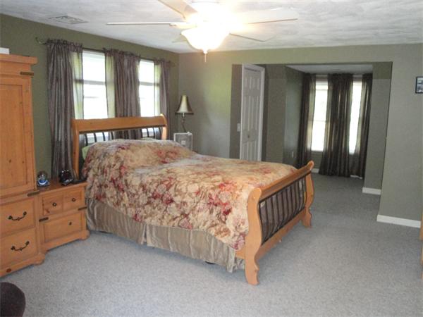 82 Campground Road Sterling, MA 01564 - Photo 17 of 23 a bedroom with a bed a window and dresser