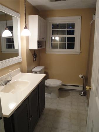 82 Campground Road Sterling, MA 01564 - Photo 18 of 23 a bathroom with a sink a toilet and a window