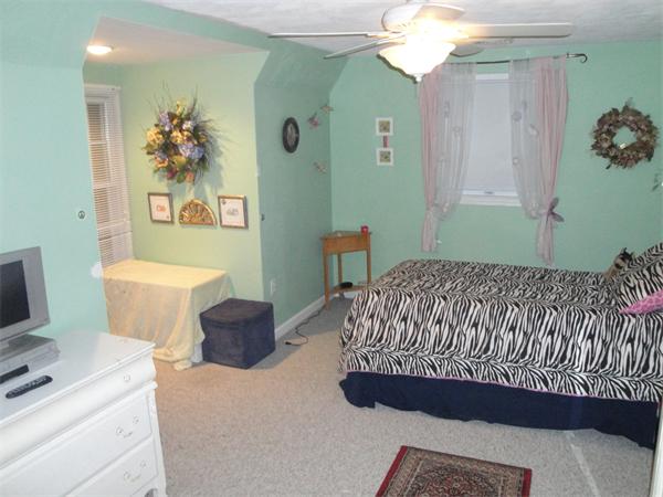 82 Campground Road Sterling, MA 01564 - Photo 19 of 23 a bedroom with a bed and a table in it