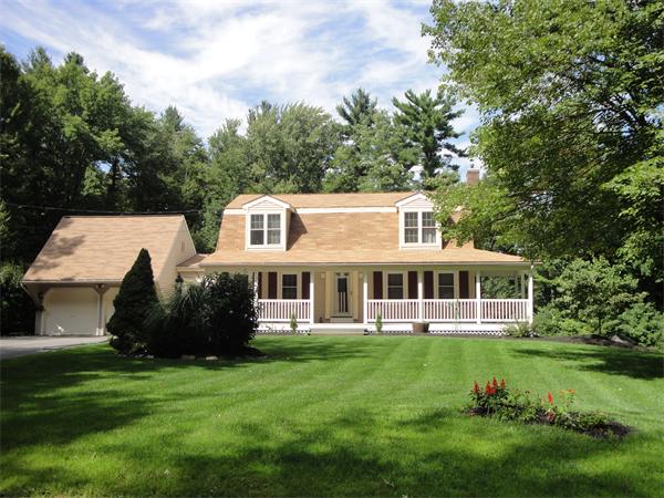 82 Campground Road Sterling, MA 01564 - Photo 2 of 23 a front view of a house with a garden