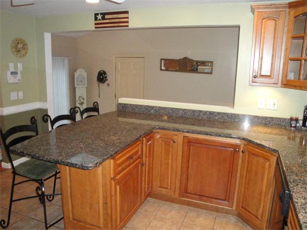 82 Campground Road Sterling, MA 01564 - Photo 6 of 23 a kitchen with stainless steel appliances granite countertop a sink and cabinets
