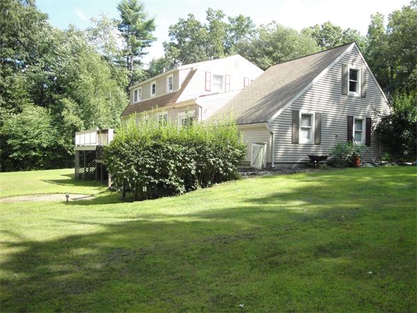 82 Campground Road Sterling, MA 01564 - Photo 10 of 23 a view of a big house with big yard and large trees