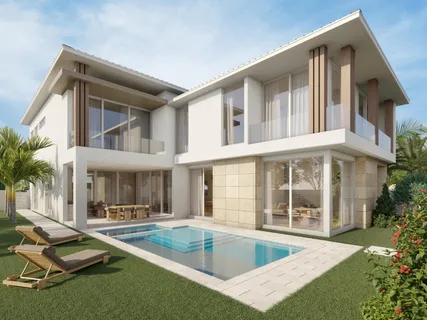 a view of a house with swimming pool and sitting area